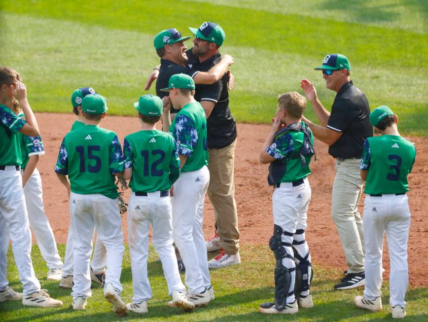 Seattle, Washington, players and coaches celebrate their win against Nolensville, Tennessee, du ...