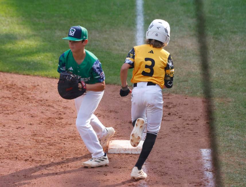 Nolensville, Tennessee, shortstop Nash Carter (3) is forced out by Seattle, Washington, third b ...