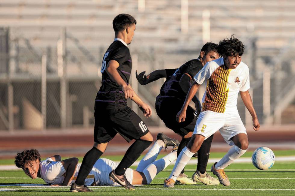 Eldorado’s Brandon Lopez, right, fights for possession of the ball after his teammate Je ...