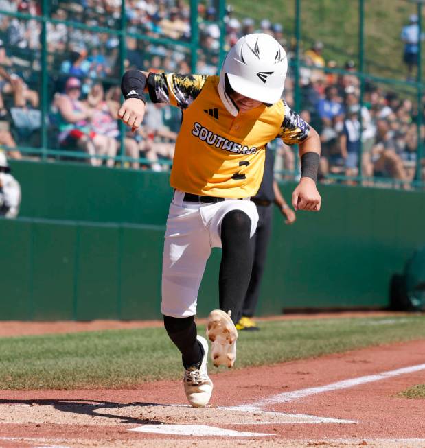 Nolensville, Tennessee, Jace Barney reacts as he scores against Henderson All-Stars during the ...