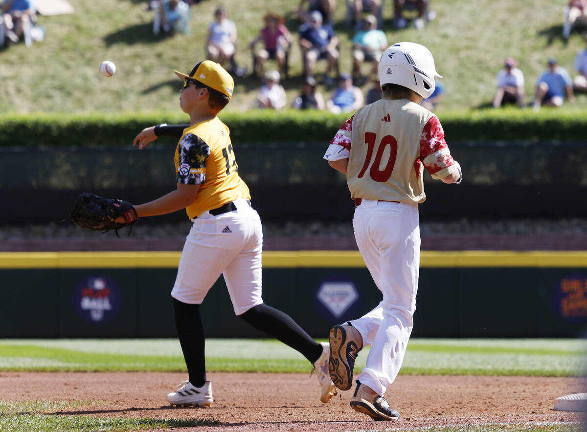 The Henderson All-Stars Truman Morris is forced out by Nolensville, Tennessee, first basman Jac ...