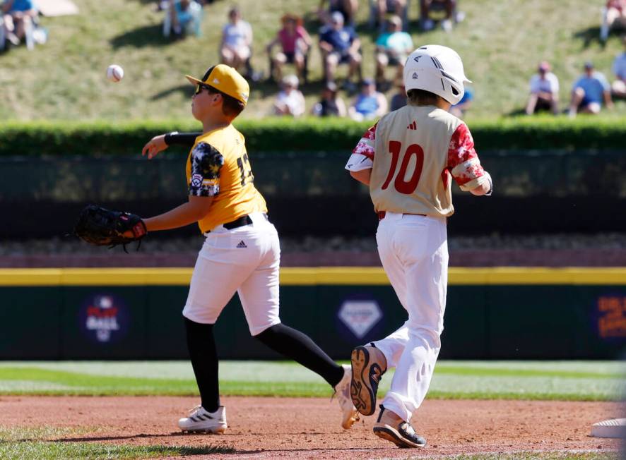 The Henderson All-Stars Truman Morris is forced out by Nolensville, Tennessee, first basman Jac ...