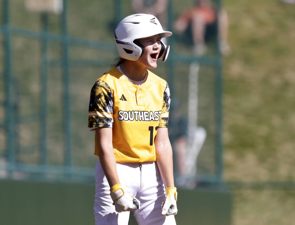 Nolensville, Tennessee, designated hitter Stella Weaver reacts after stealing third base during ...