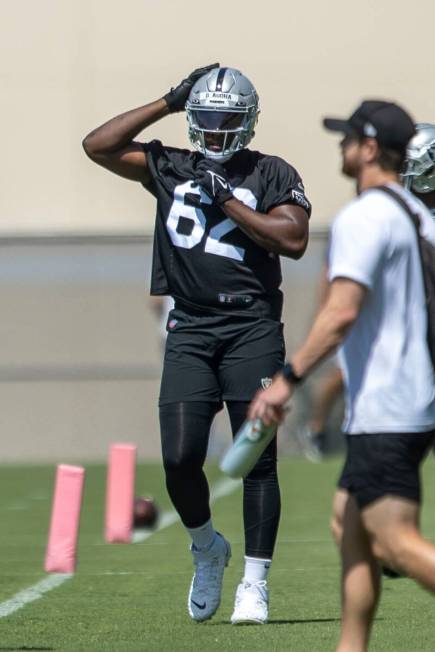 Raiders defensive end David Agoha (62) adjusts his helmet during the team’s mandatory minicam ...