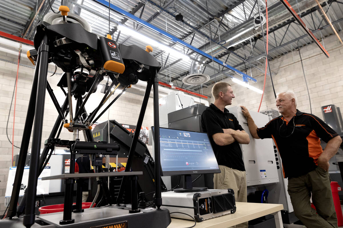 Manufacturing machines are on display during an opening event for the Debra March Center of Exc ...