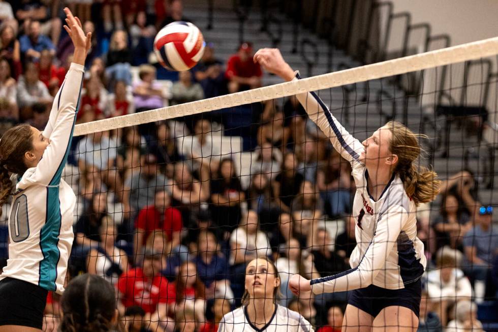 Coronado’s Hannah Wayment (1) spikes to Silverado’s Lauryn Allen (10), who goes f ...