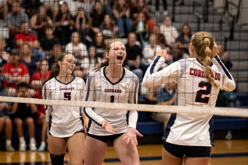 Coronado’s Hannah Pemberton (5), Hannah Wayment (1) and Julie Beckham (2) celebrate a po ...