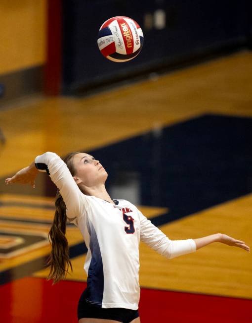 Coronado’s Hannah Pemberton (5) serves to Silverado during a high school volleyball game ...