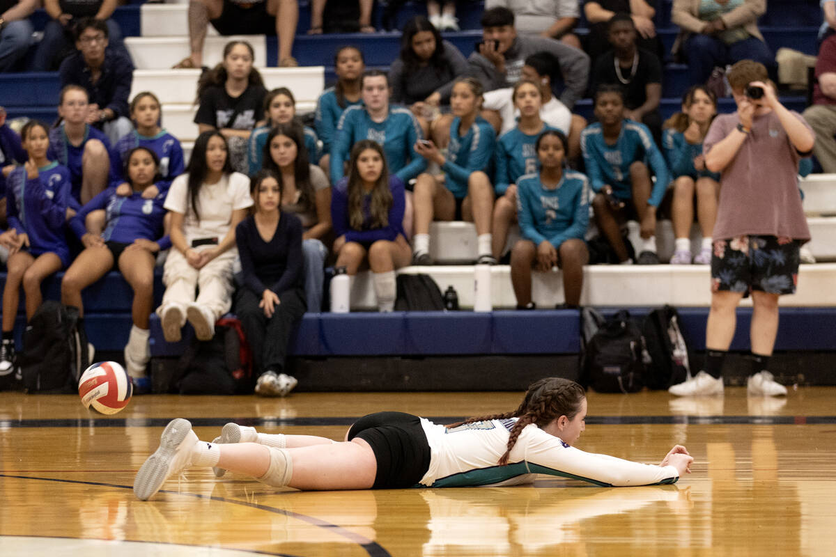 Silverado’s Summer Cosbey misses the ball in a dive during a high school volleyball game ...