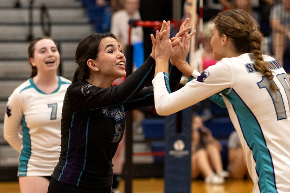 Silverado’s Elisa Baltierrez (5) celebrates a point with teammate Lauryn Allen (10) duri ...