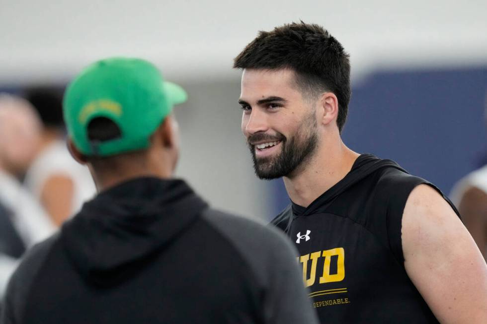 Quarterback Sam Hartman, a transfer from Wake Forest to Notre Dame, smiles as he talks with Not ...