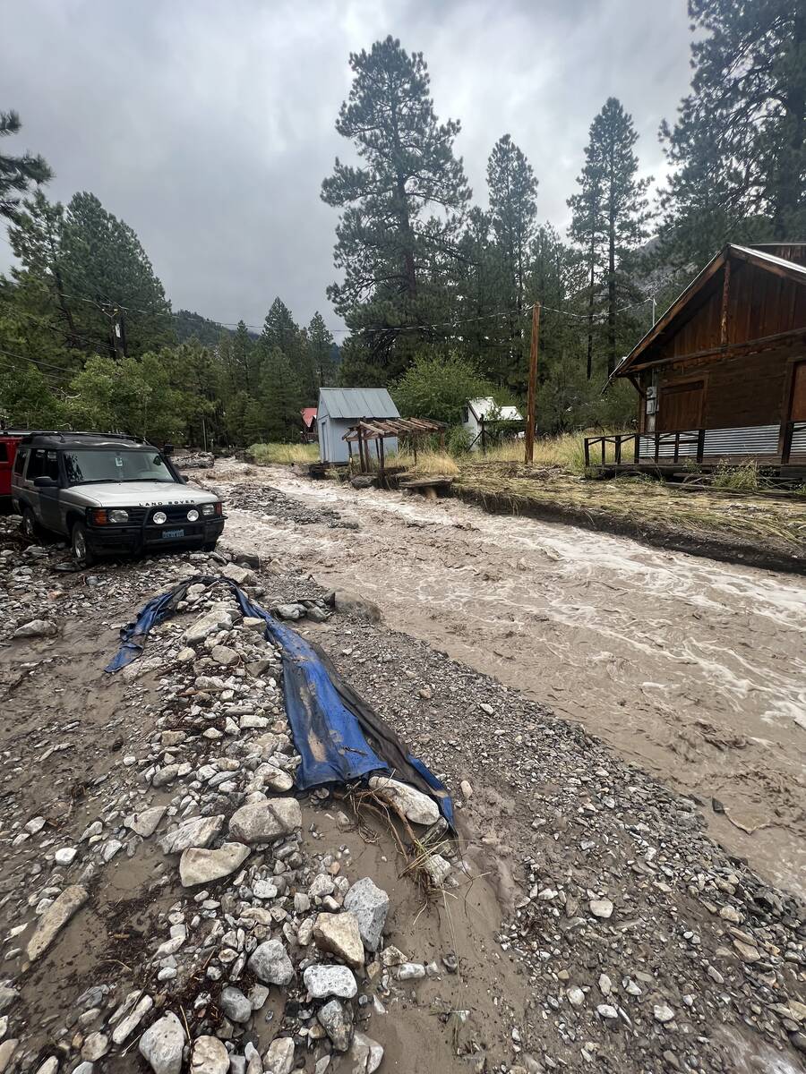 Flooding outside Katie and Sean Reeh's Old Town home on Mount Charleston on Monday, Aug. 21, 20 ...