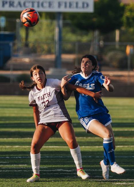 Faith Lutheran fullback Sophie Baumgart (32) tries to keep Bishop Gorman forward Hunter Borgel ...