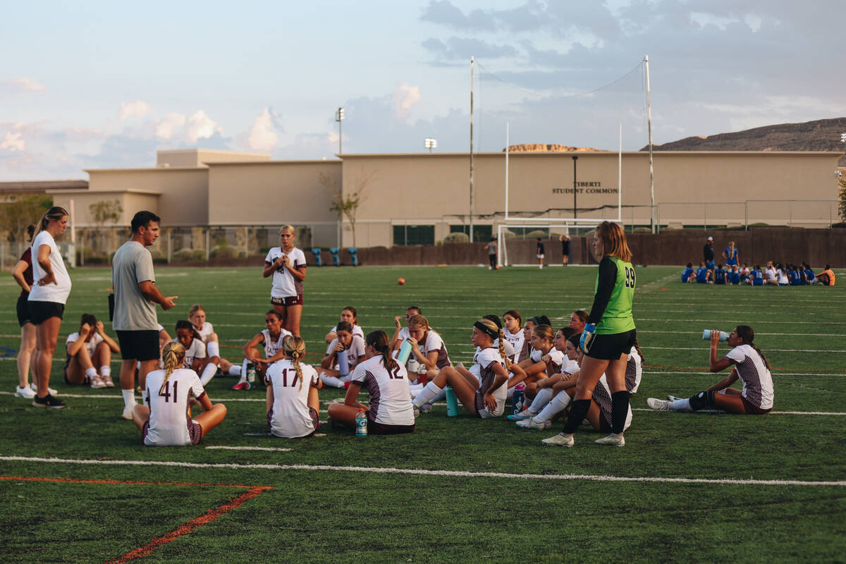 The Faith Lutheran girls soccer team regroups during halftime during a game against Bishop Gorm ...
