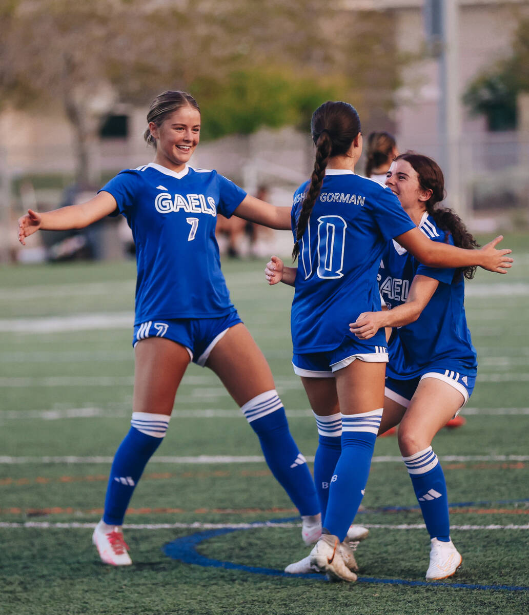 Bishop Gorman’s Stephenie Hackett (10) celebrates with her teammates after making a penalty k ...