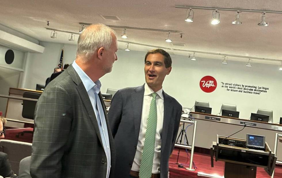 Oakland Athletics President Dave Kaval, right, talks with LVCVA CEO Steve Hill before the Aug. ...