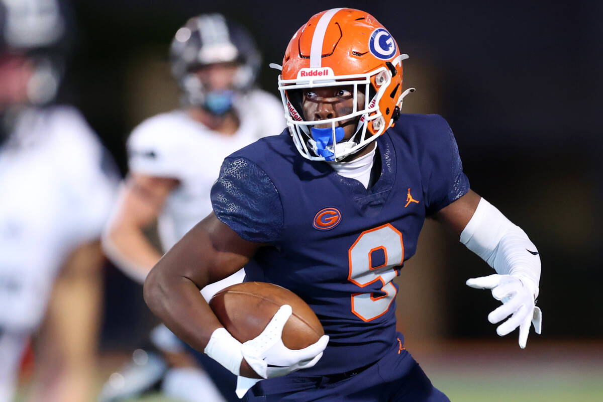 Bishop Gorman's Elija Lofton (9) runs the ball against Corner Canyon during the first half of a ...