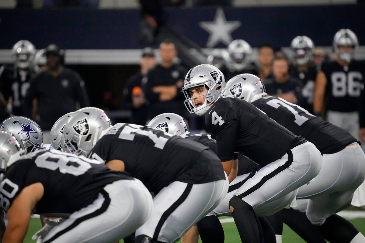 Las Vegas Raiders quarterback Aidan O'Connell (4) signals at the line of scrimmage during the f ...