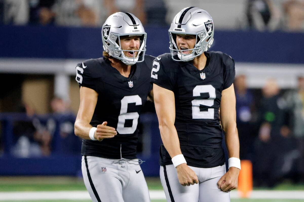 Las Vegas Raiders punter AJ Cole (6) and place kicker Daniel Carlson (2) celebrate after Carlso ...