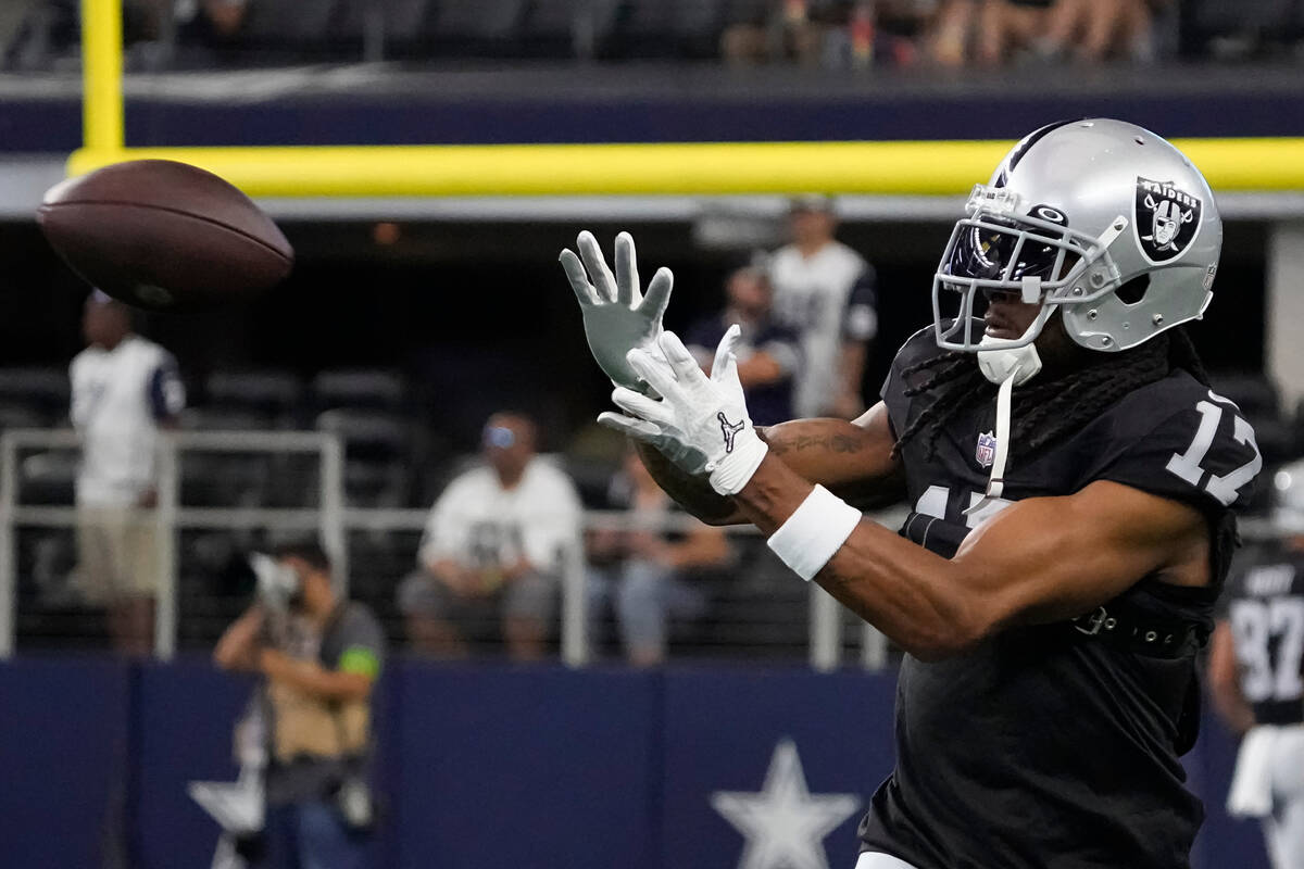 Las Vegas Raiders wide receiver Davante Adams warms up before a preseason NFL football game aga ...