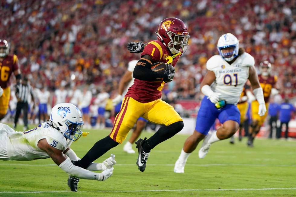 Southern California wide receiver Zachariah Branch (1) runs toward the end zone for a touchdown ...