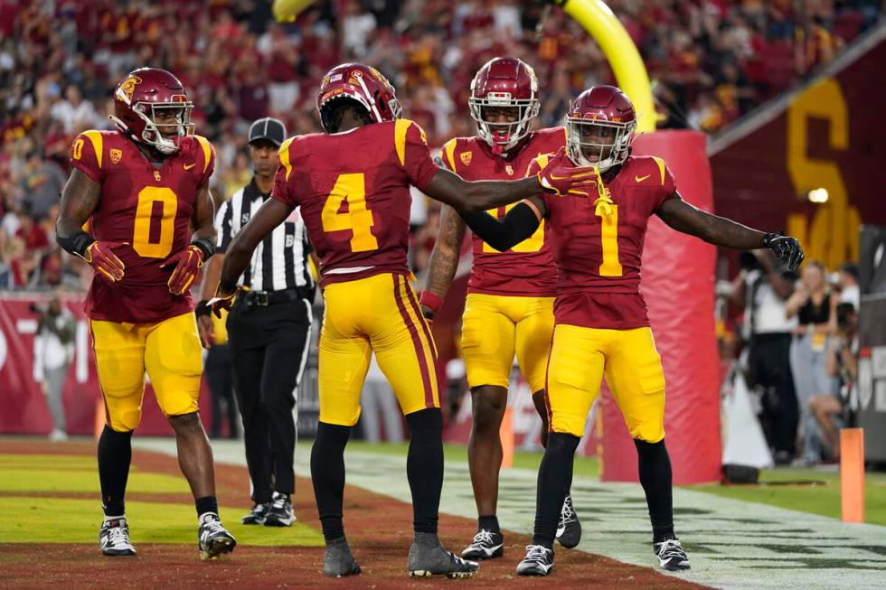 Southern California wide receiver Zachariah Branch (1) celebrates his touchdown against San Jos ...