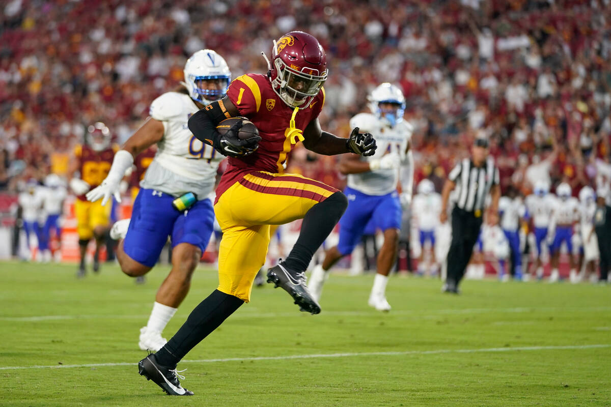 Southern California wide receiver Zachariah Branch runs toward the end zone for a touchdown dur ...