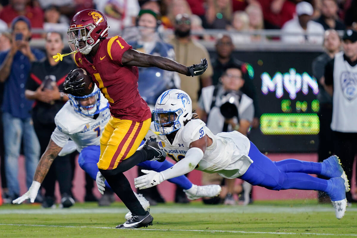 Southern California wide receiver Zachariah Branch (1) runs to score past San Jose State lineba ...