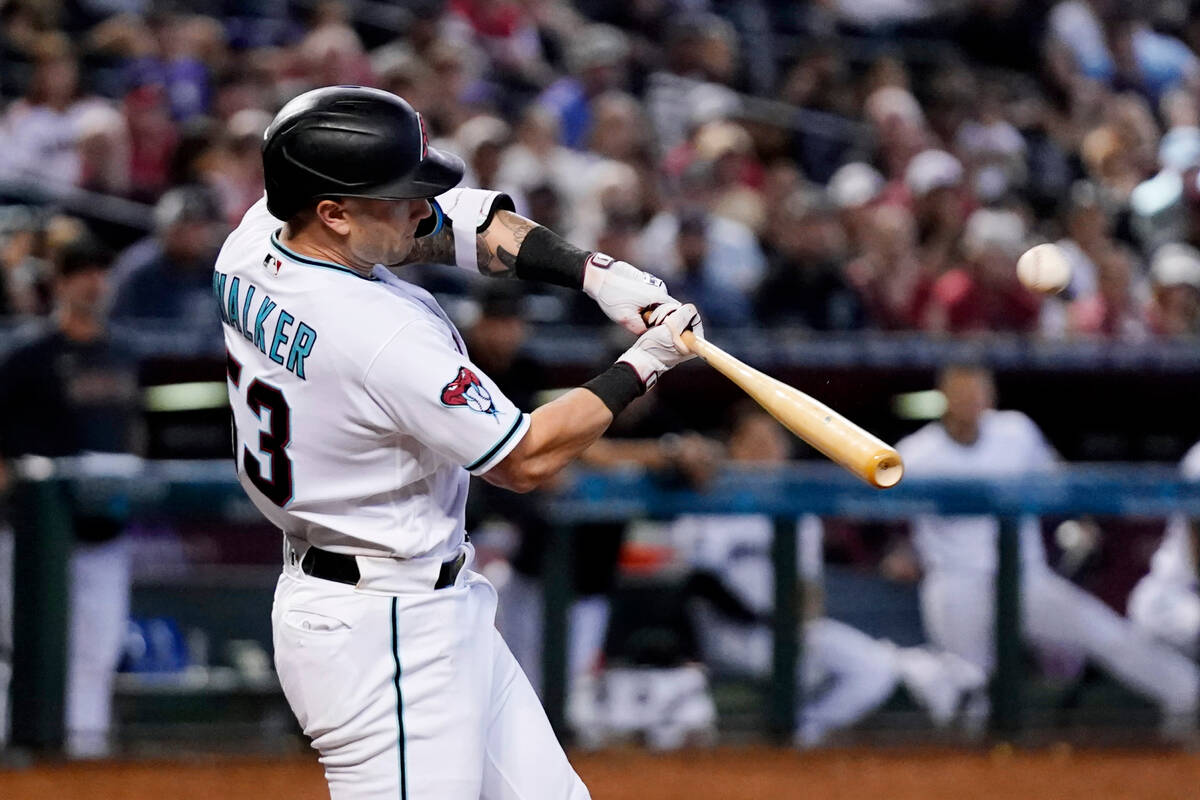 Arizona Diamondbacks' Christian Walker connects for a sacrifice fly against the Cincinnati Reds ...