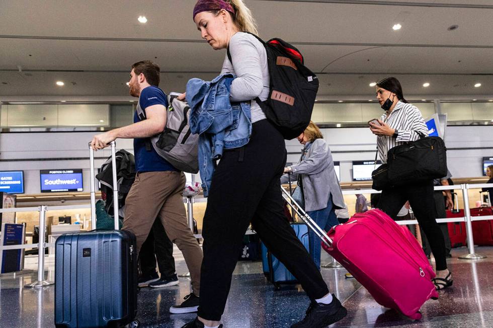 Passengers prepare to check in at Southwest check in counter in Terminal 1 of Harry Reid Intern ...