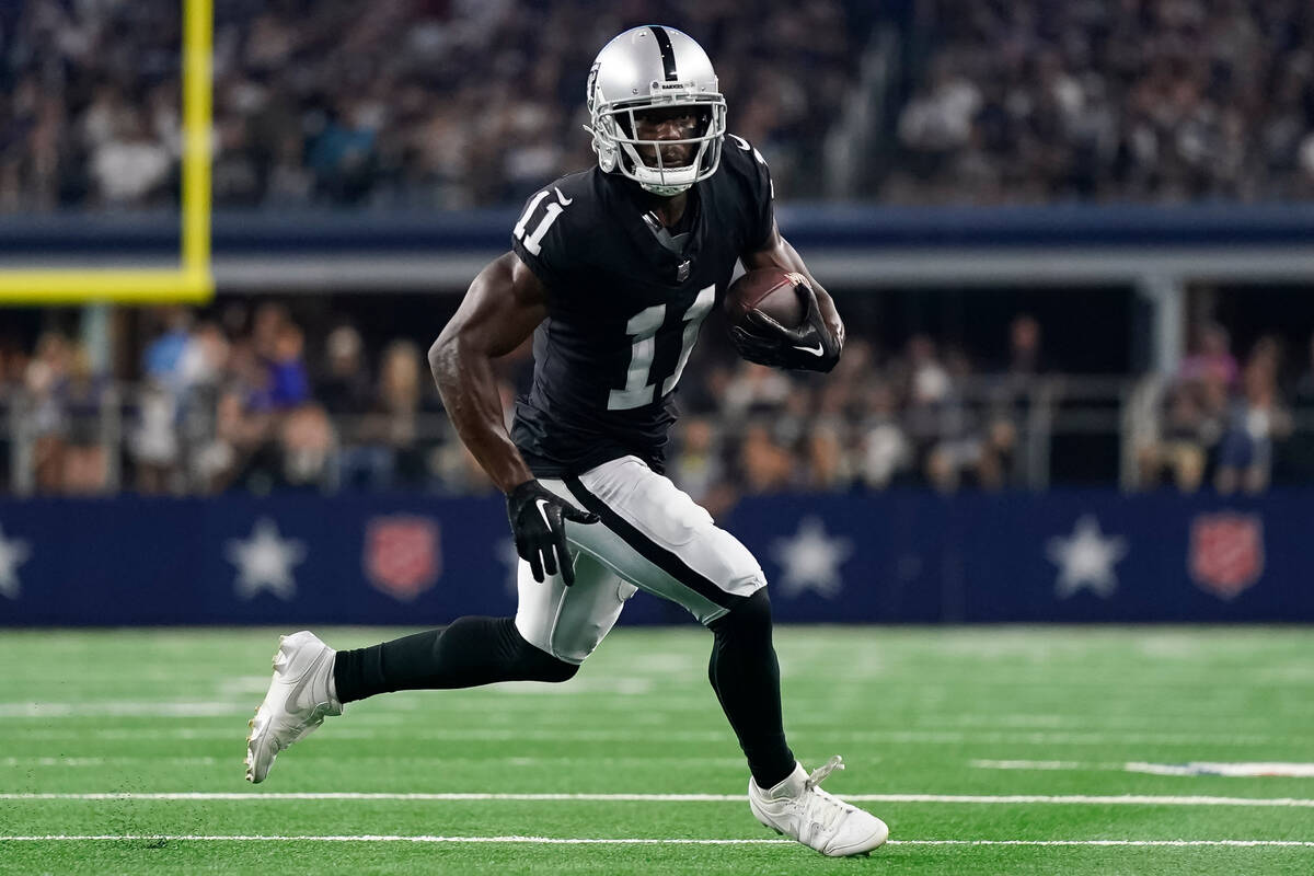 Las Vegas Raiders wide receiver Phillip Dorsett runs with the ball during the second half of a ...