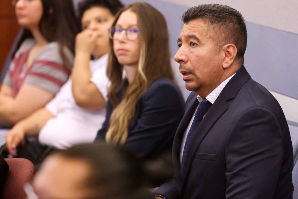 Former Alpine Motel Apartments owner Adolfo Orozco-Garcia, right, waits to apper in Clark Count ...