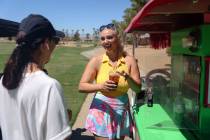 Cass Holland, a cart girl with a massive Tik Tok following, serves a drink to Maria at Chimera ...