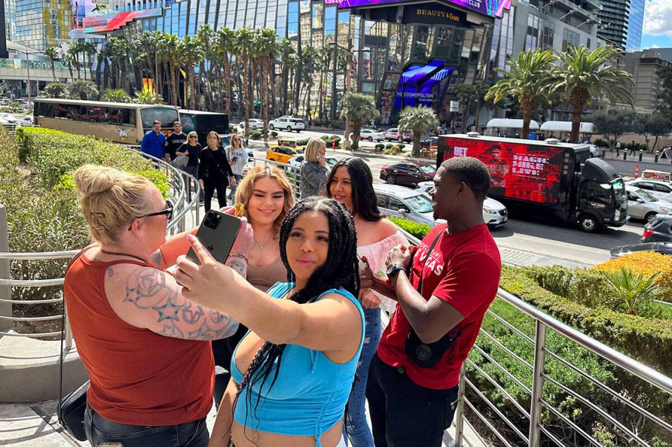 Nya Hudson, 21, of Washington takes a selfie on the Strip at Planet Hollywood Resort in Las Veg ...