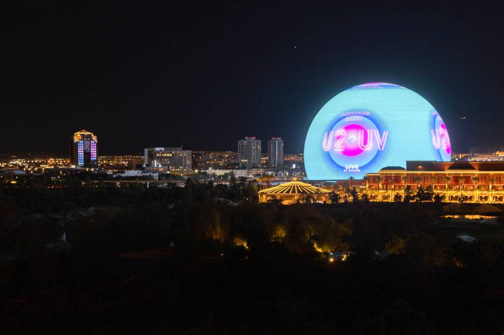 The Sphere shows an advertisement for its opening show, U2, as seen from the Encore parking gar ...