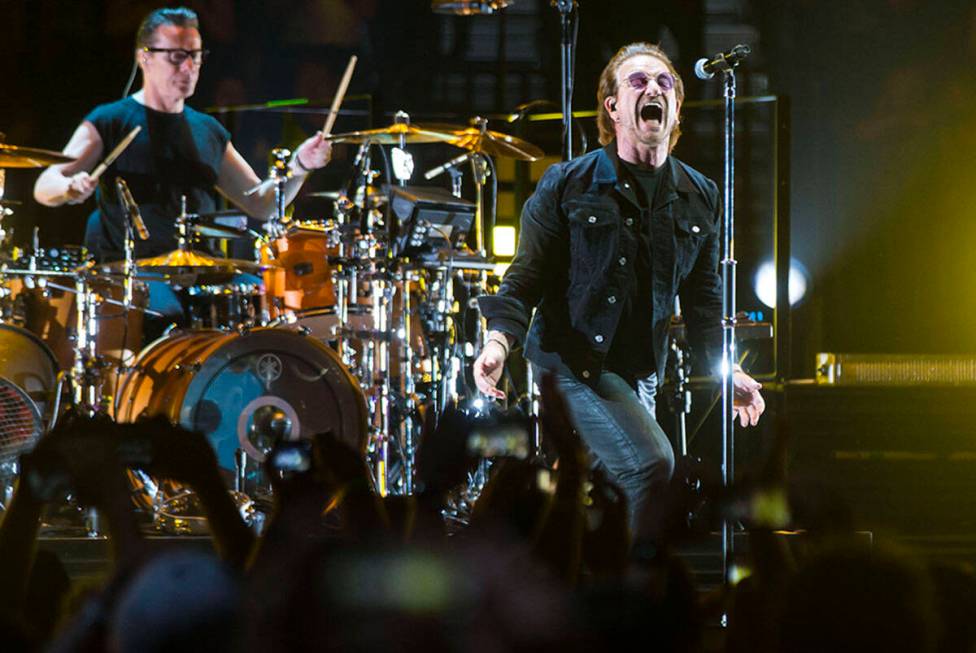 Larry Mullen Jr., left, and Bono of U2 perform at T-Mobile Arena in Las Vegas on Friday, May 11 ...