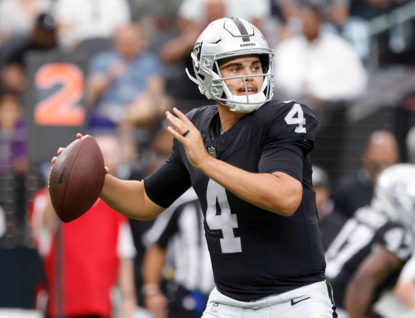 Raiders quarterback Aidan O'Connell (4) throws a pass during the second half of an NFL preseaso ...