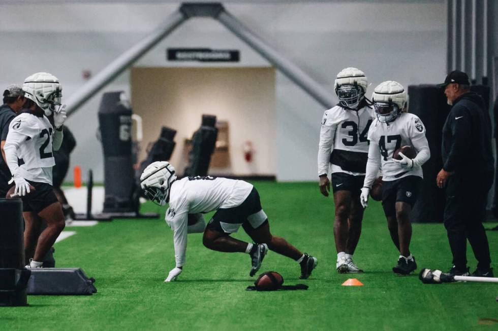 Raiders running back Josh Jacobs (8) runs through a drill during practice at the Intermountain ...