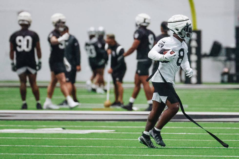 Raiders running back Josh Jacobs (8) runs a drill during practice at the Intermountain Healthca ...