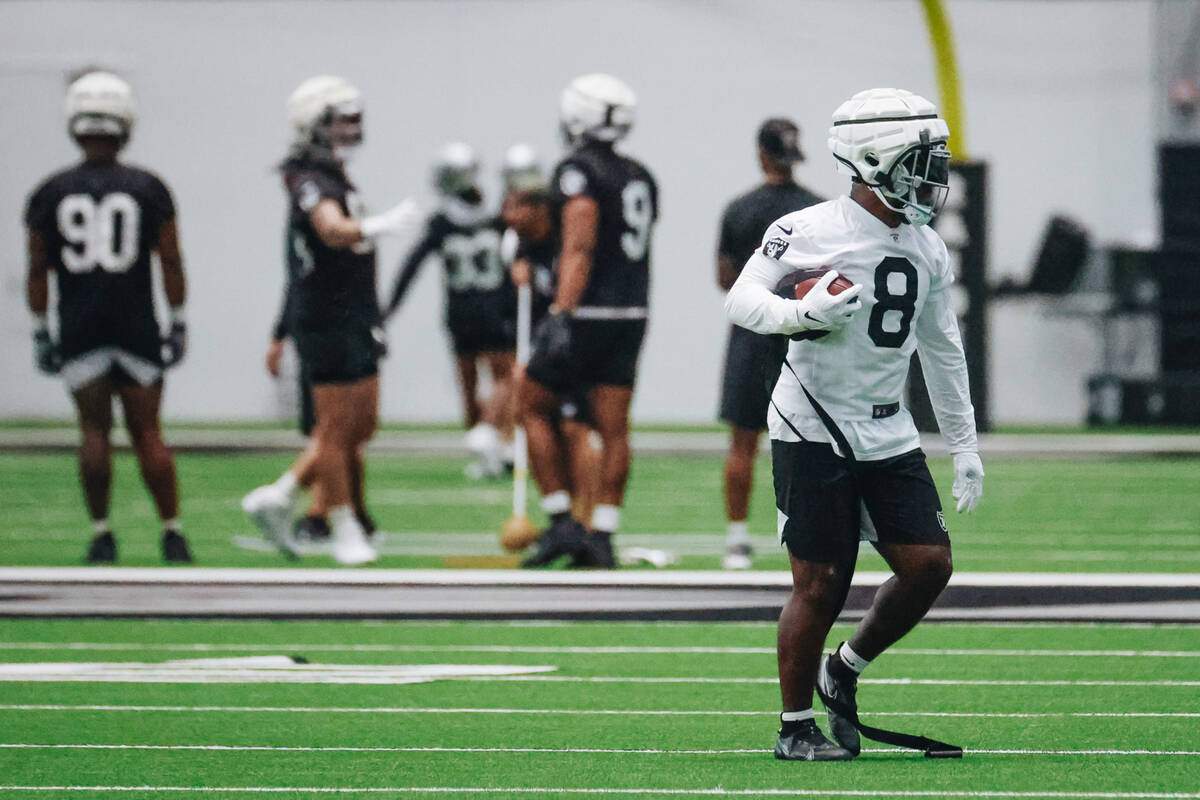 Raiders running back Josh Jacobs (8) runs a drill during practice at the Intermountain Healthca ...