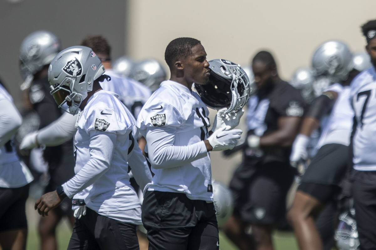 Raiders wide receiver Phillip Dorsett (11) removes his helmet during the team’s mandator ...