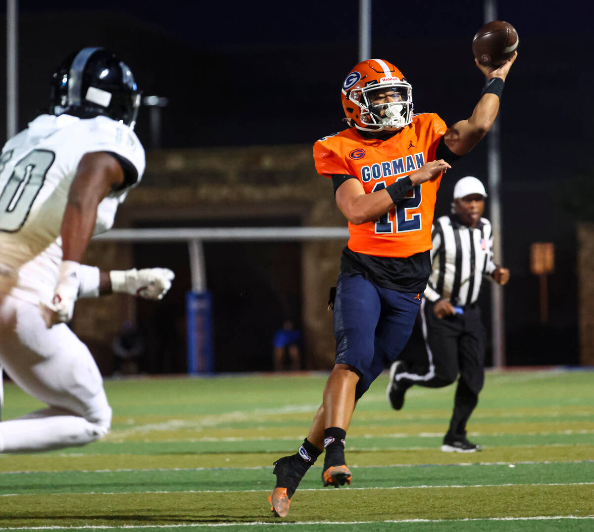 Bishop Gorman Micah Alejado (12) throws a touchdown pass to Zachariah Branch, not pictured, aga ...