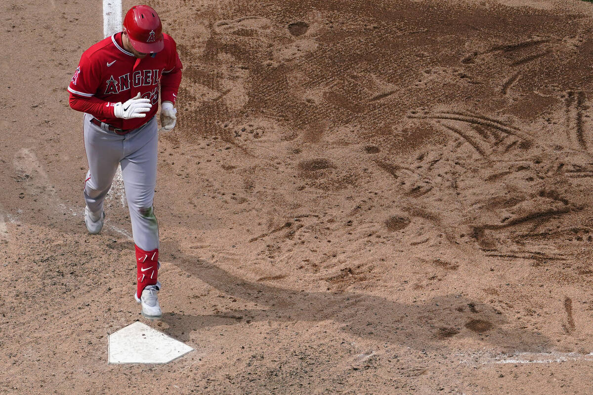 Los Angeles Angels' Brandon Drury crosses home after hitting a two-run home run against Philade ...