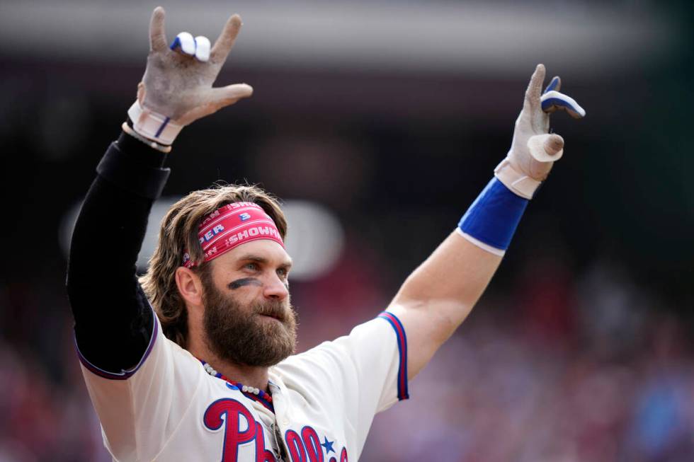 Philadelphia Phillies' Bryce Harper reacts after hitting a two-run home run during the eighth i ...