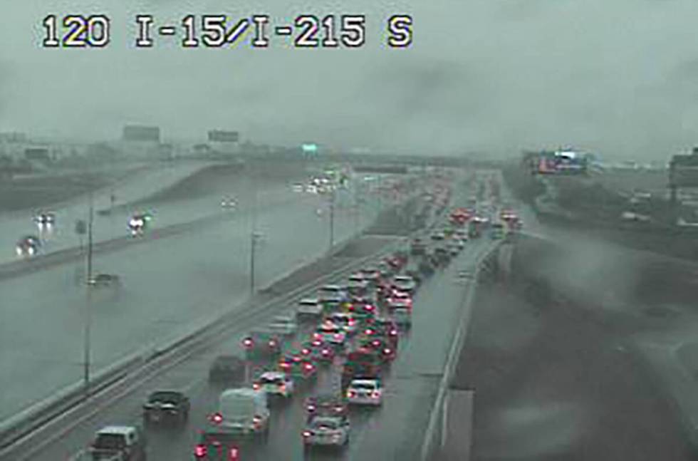 Motorists in heavy rain at Interstate 15 and the 215 Beltway about 3:10 p.m. Friday, Sept. 1, 2 ...