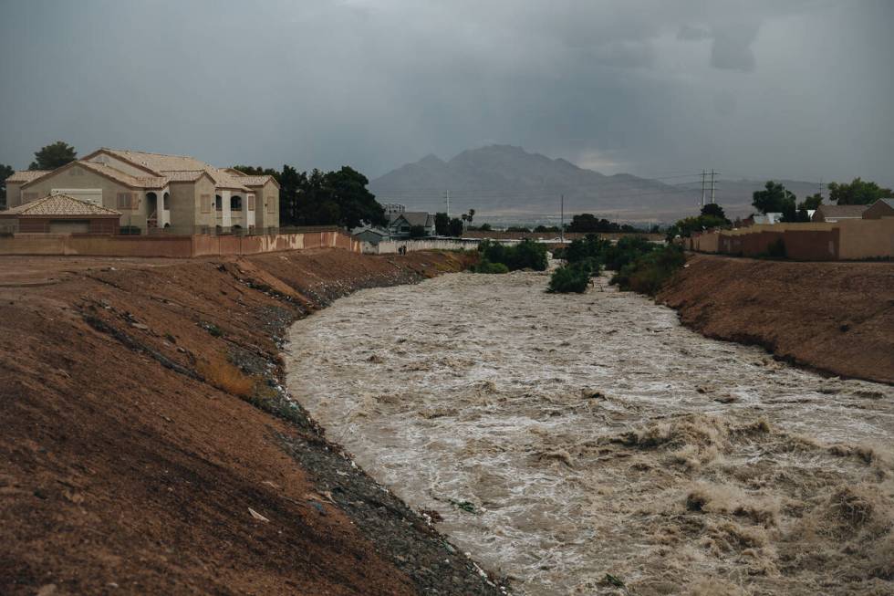 Duck Creek rages with water from recent rainfall near Jack in the Box at East Russell Road on F ...