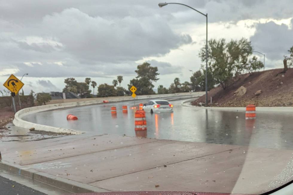 A car is stuck Friday. Sept. 1, 2023, at the on ramp for U.S. Highway 95 at Flamingo Road in La ...