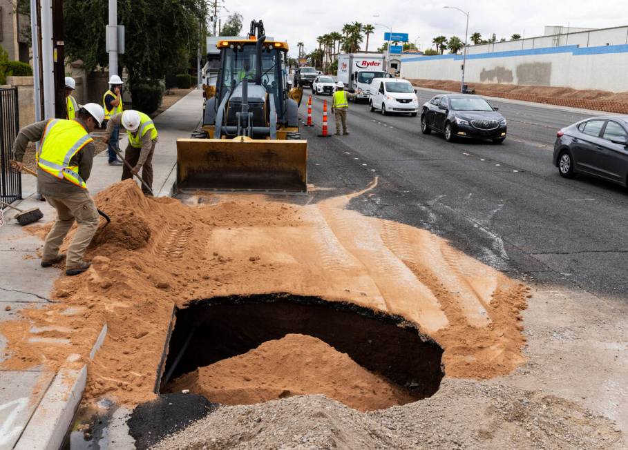 Traffic is backed up as crews continue to repair a large sinkhole near Jones Boulevard and Roch ...