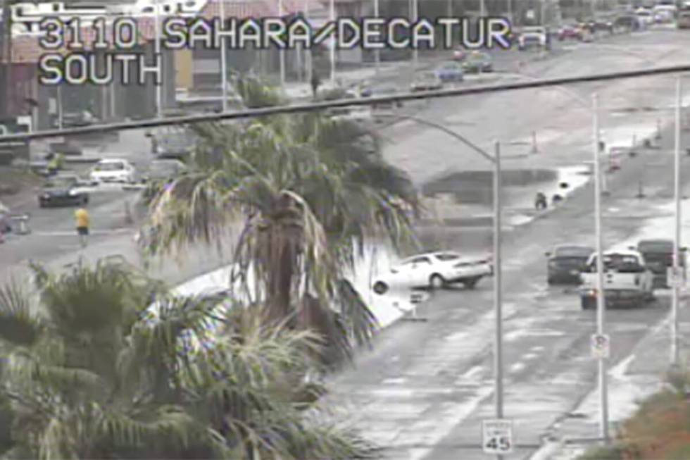 Heavy rain caused a vehicle to get stuck at the intersection of Sahara Avenue and Decatur Boule ...