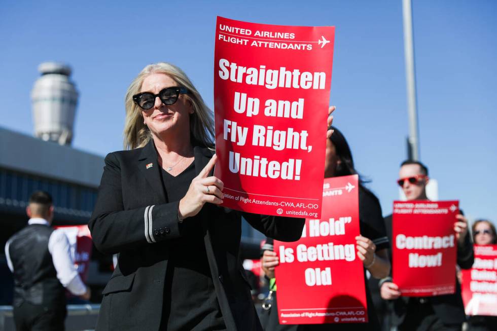 Neena Boswell participates in a picket line march to obtain a new contract and improvements to ...